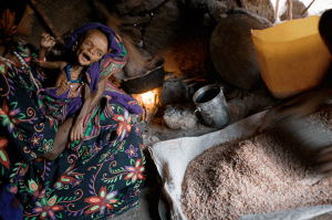 The face of malnutrition is becoming what I see more and more when I have a bite of meat.  Photo by John Stanmeyer via National Geographic.