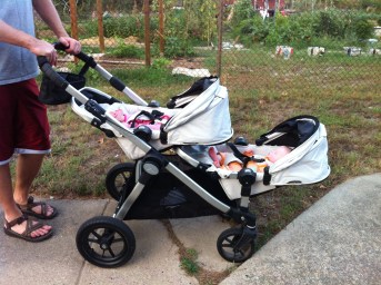 Baby Jogger with the seats facing backward and fully reclined.