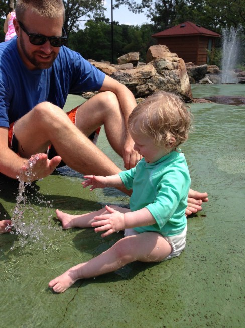 Splashing happily at the splash pad.