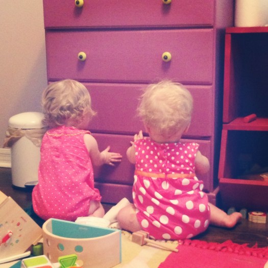 Teamwork: working together to open the drawer and remove all the diapers inside. Sibling love!