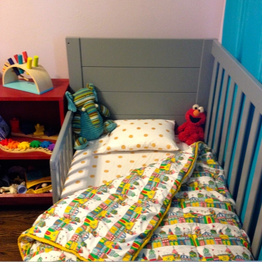 The cribs are Baby Mod from Wal Mart. The Small World-esque bedding is from Land of Nod.