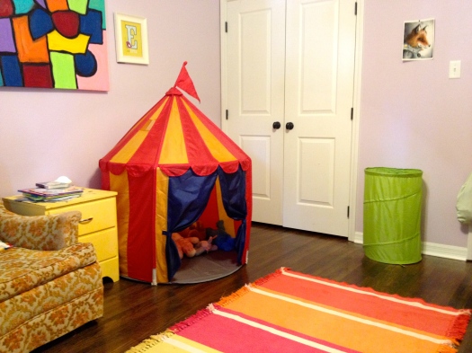 The Ikea circus tent makes a great storage zone for stuffed animals. Their dresser is actually inside the closet-- less chance of kiddos pulling everything out of drawers that way.