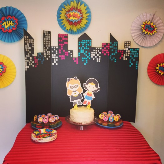 Superhero Girls' Fourth Birthday Party Cake Table Setup